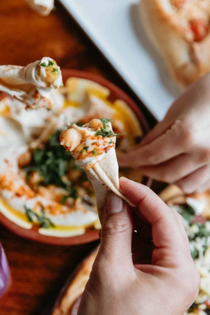 Classic hummus with pita bread and olive oil