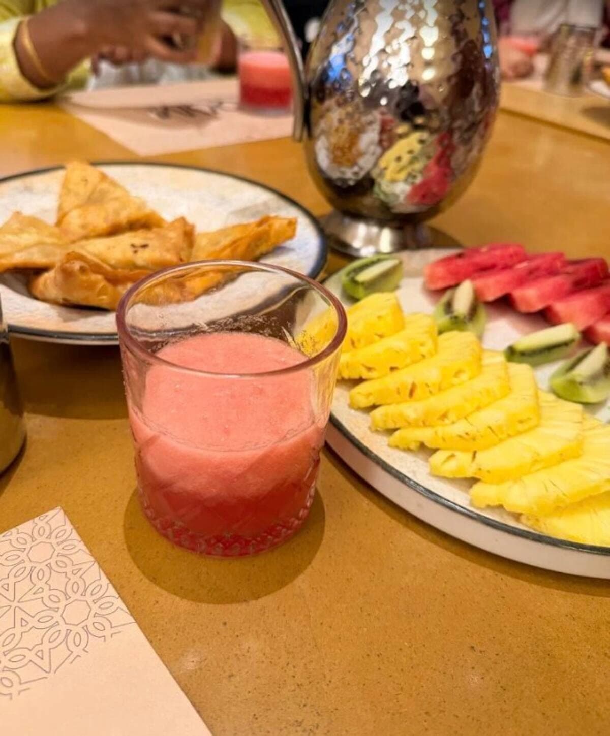 Fresh juices, fruit platter, and starters at QumQum